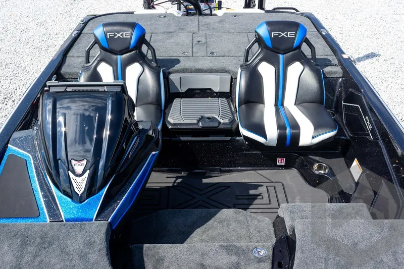 Slide: The Image of 2027 Skeeter FXE20 Pro boat interior with dual black and blue seats. - 17