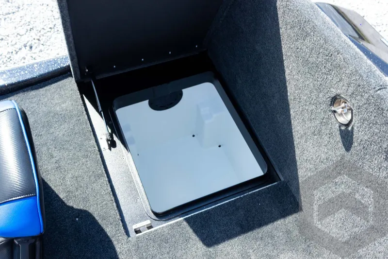 Slide: The Image of Open storage compartment in 2027 Skeeter FXE20 Pro boat interior. - 24