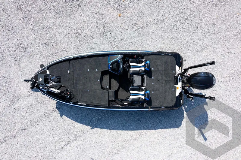 Slide: The Image of Aerial view of 2027 Skeeter FXE20 Pro fishing boat on gravel surface. - 27