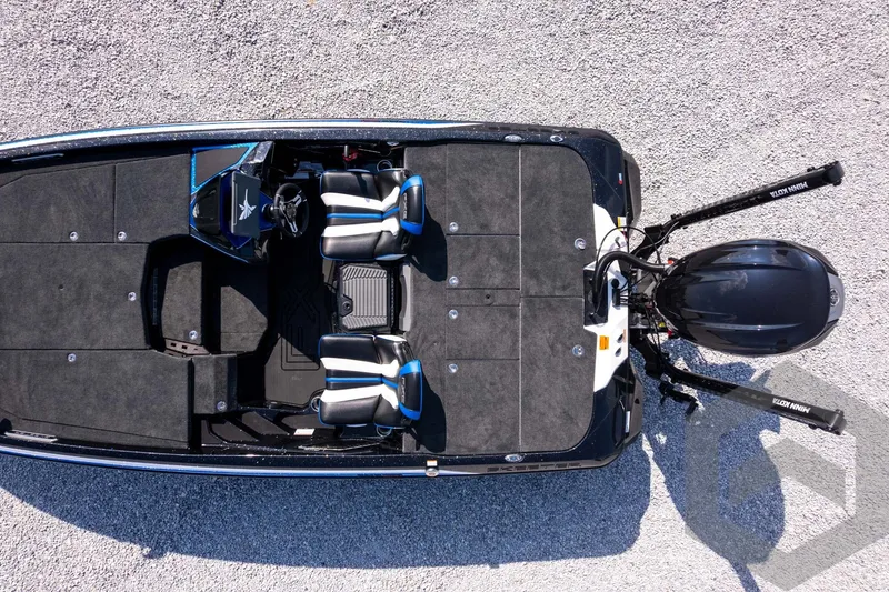 Slide: The Image of Top view of 2027 Skeeter FXE20 Pro boat on gravel surface. - 29