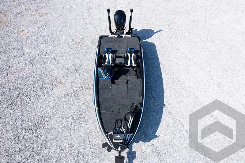 Slide: The Image of Aerial view of 2027 Skeeter FXE20 Pro fishing boat on gravel surface. - 37