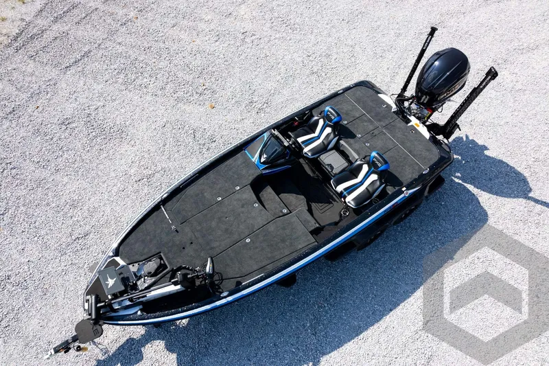 Slide: The Image of Aerial view of 2027 Skeeter FXE20 Pro fishing boat on gravel surface. - 30