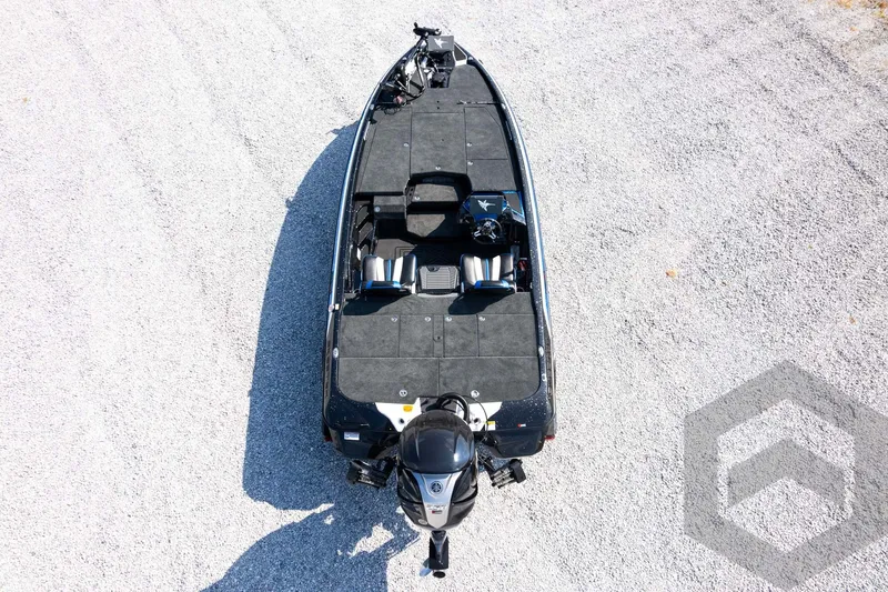Slide: The Image of Aerial view of 2027 Skeeter FXE20 Pro fishing boat on gravel surface. - 33