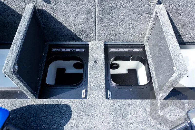 Slide: The Image of Open storage compartments on a 2027 Skeeter FXE20 Pro boat deck. - 22