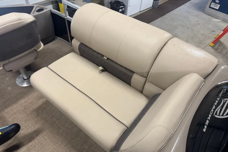 Slide: The Image of 2021 Sun Tracker Fishin' Barge 20 DLX beige seating in a boat interior. - 20