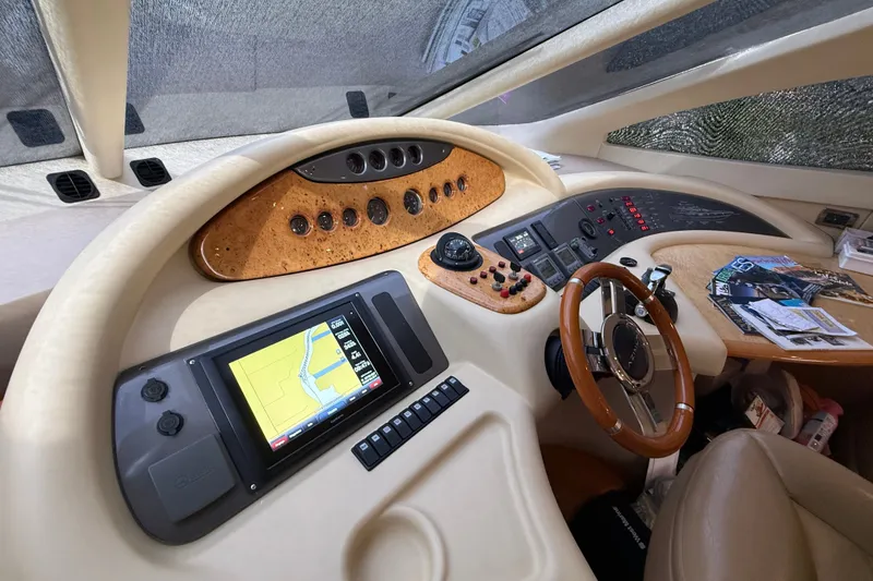 Slide: The Image of Cockpit of 2008 Azimut 62E yacht with navigation controls and steering wheel. - 29