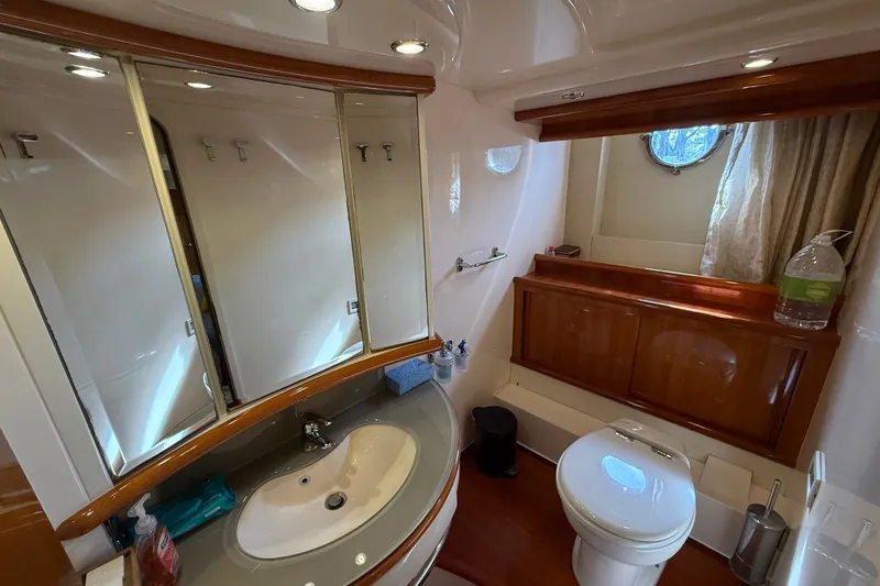 Slide: The Image of Luxurious bathroom in 2008 Azimut 62E yacht with elegant fixtures and wooden accents. - 38