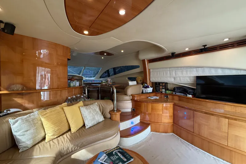 Slide: The Image of Luxurious interior of a 2008 Azimut 62E yacht with elegant wood finishes and plush seating. - 22