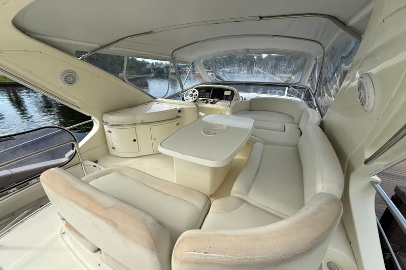 Slide: The Image of Luxurious 2008 Azimut 62E yacht interior with elegant white seating and helm station. - 5