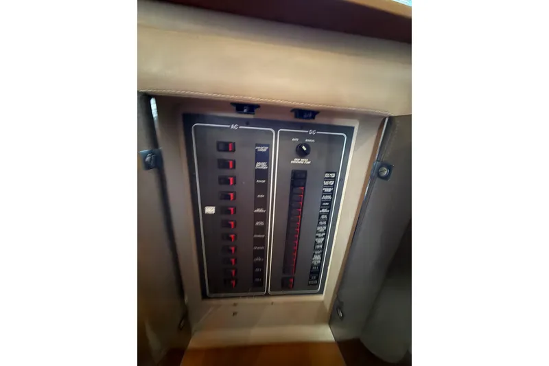 Slide: The Image of Control panel of a 2008 Azimut 62E yacht, featuring AC and DC switches. - 32