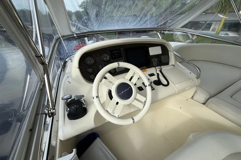 Slide: The Image of Cockpit of 2008 Azimut 62E yacht with steering wheel and navigation controls. - 11