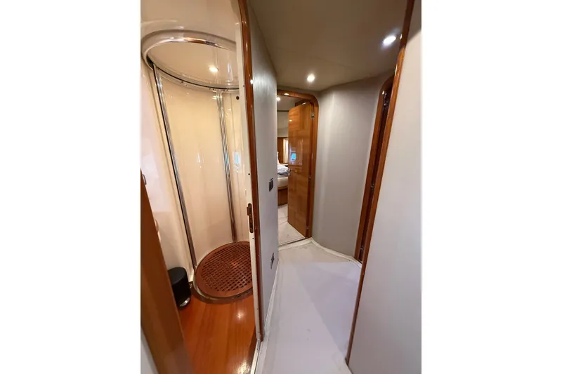 Slide: The Image of Interior hallway of 2008 Azimut 62E yacht with wooden accents and modern shower. - 41