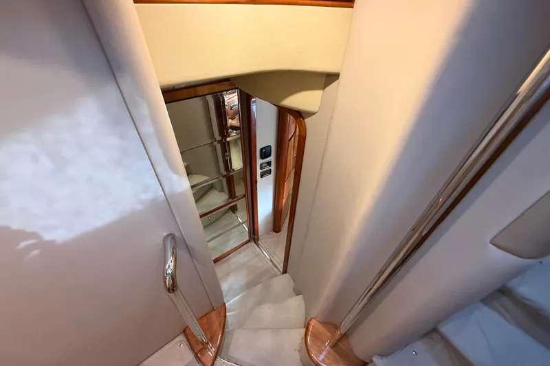 Slide: The Image of Interior staircase of 2008 Azimut 62E yacht with wooden accents and modern design. - 34