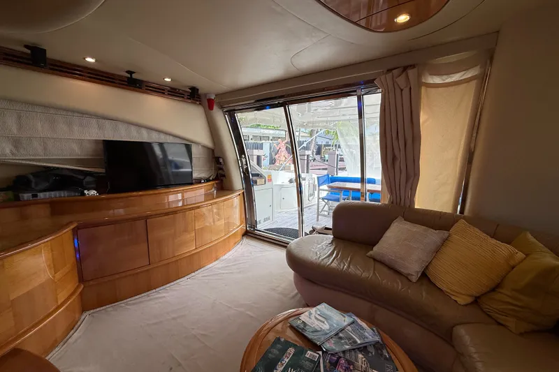 Slide: The Image of Luxurious interior of a 2008 Azimut 62E yacht with plush seating and modern amenities. - 23
