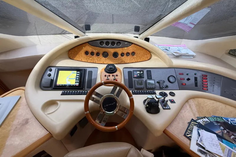 Slide: The Image of Cockpit of 2008 Azimut 62E yacht with navigation controls and steering wheel. - 28