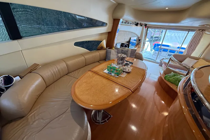 Slide: The Image of Luxurious interior of a 2008 Azimut 62E yacht with elegant seating and wooden table. - 31