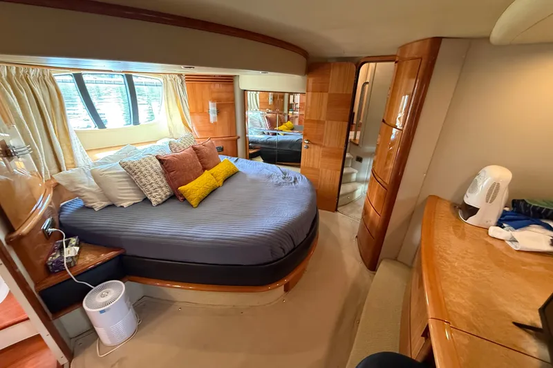 Slide: The Image of Luxurious 2008 Azimut 62E yacht bedroom with elegant wood finishes and plush bedding. - 37