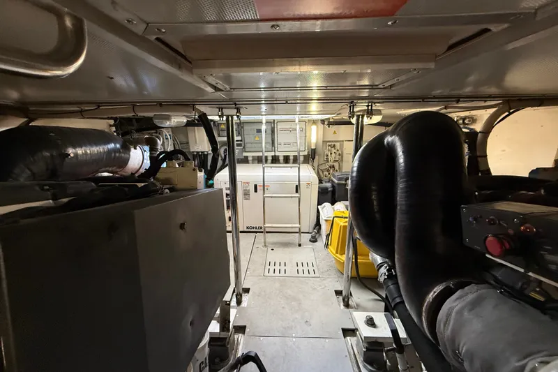 Slide: The Image of Engine room of a 2008 Azimut 62E yacht, featuring mechanical equipment and systems. - 55
