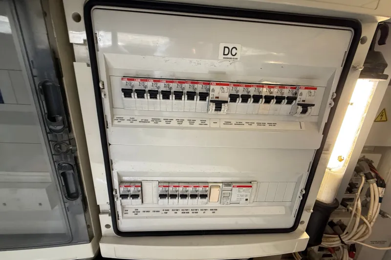 Slide: The Image of Electrical panel on a 2008 Azimut 62E yacht, featuring multiple circuit breakers. - 57