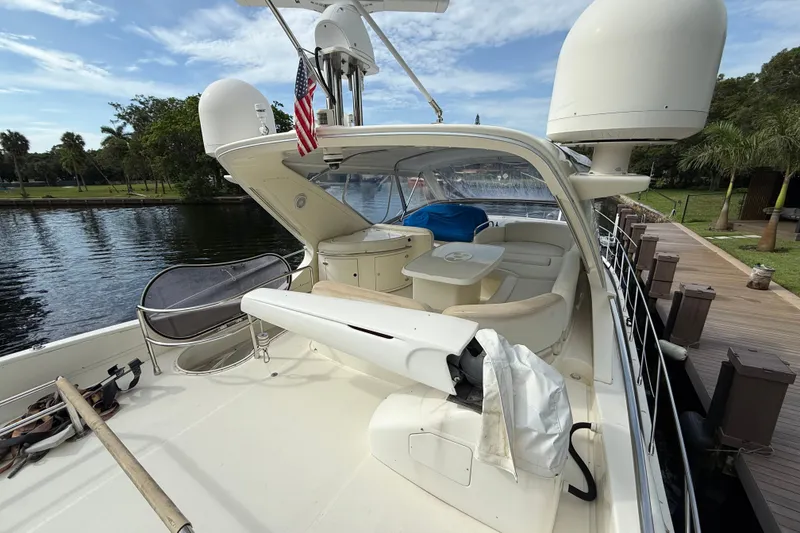Slide: The Image of Luxurious 2008 Azimut 62E yacht docked by a scenic waterfront. - 15