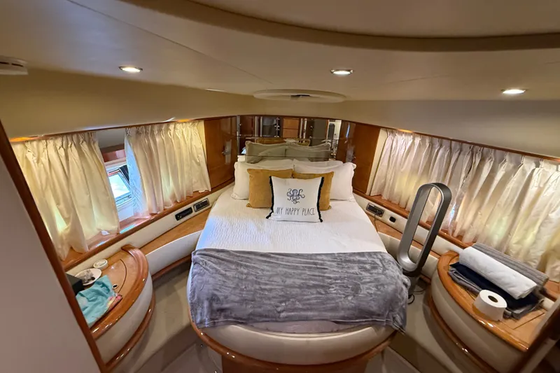Slide: The Image of Luxurious bedroom interior of 2008 Azimut 62E yacht with cozy bedding and elegant decor. - 42