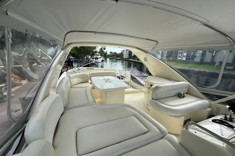 Slide: The Image of Luxurious interior of 2008 Azimut 62E yacht with elegant seating and scenic waterway view. - 8