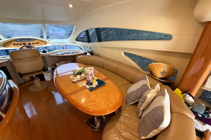 Slide: The Image of Luxurious interior of a 2008 Azimut 62E yacht with elegant seating and helm station. - 25