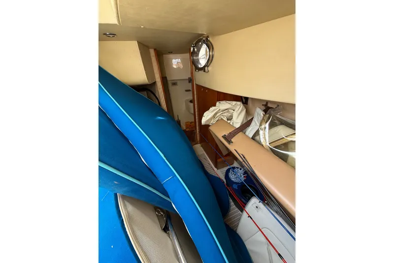 Slide: The Image of Interior of 2008 Azimut 62E yacht with blue cushions and fishing rods. - 52