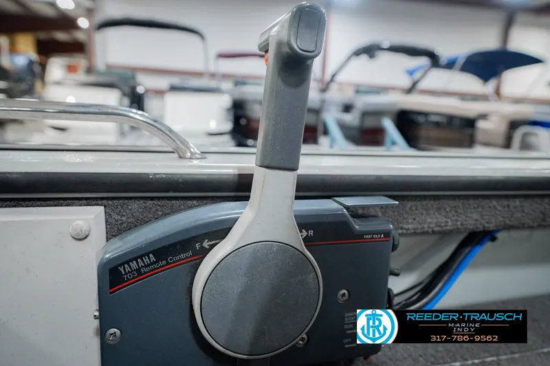 Slide: The Image of Yamaha 703 remote control on a 1999 Lund Mr. Pike 17 boat, Reeder-Trausch Marine. - 39