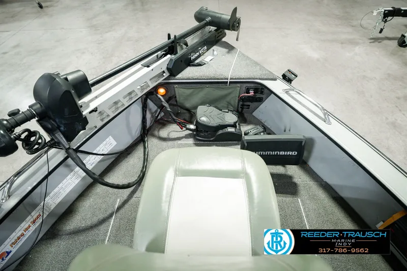 Slide: The Image of 1999 Lund Mr. Pike 17 boat interior with Humminbird electronics and Minn Kota trolling motor. - 20