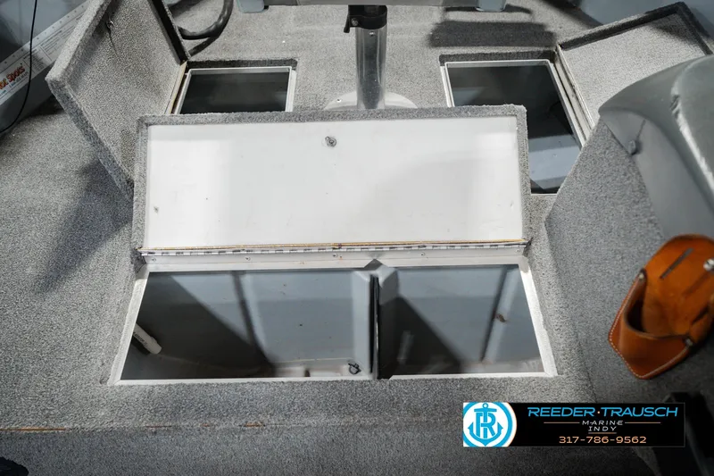 Slide: The Image of 1999 Lund Mr. Pike 17 boat interior with open storage compartments. - 30