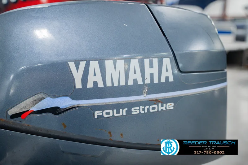 Slide: The Image of Yamaha four-stroke engine on a 1999 Lund Mr. Pike 17 boat, Reeder-Trausch Marine. - 51