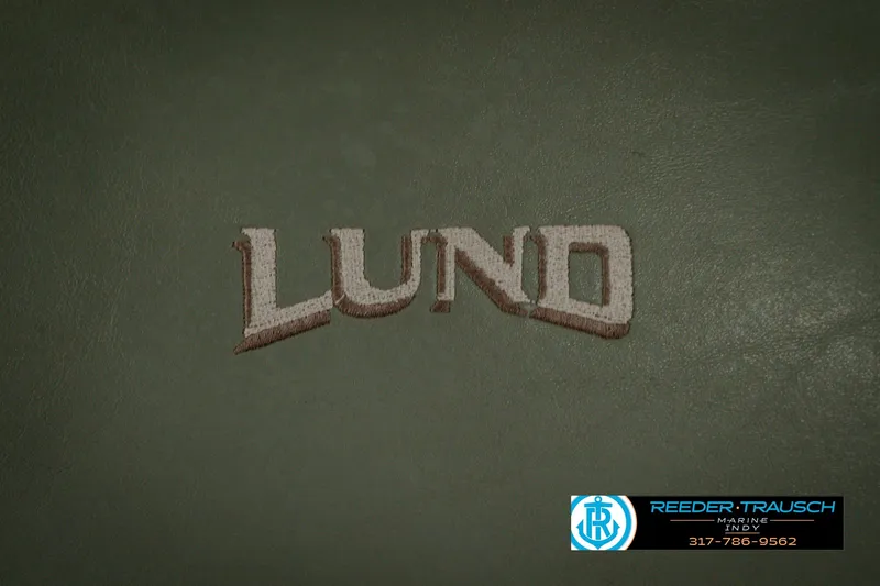 Slide: The Image of Lund logo on a 1999 Mr. Pike 17 boat, with Reeder Trausch Marine contact. - 42