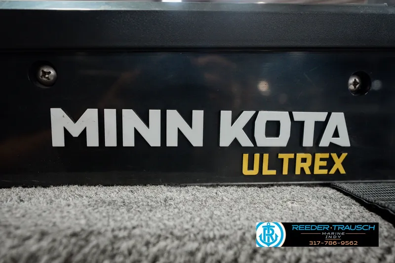Slide: The Image of Minn Kota Ultrex motor on 1999 Lund Mr. Pike 17 boat, Reeder-Trausch Marine logo visible. - 55