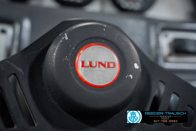 Slide: The Image of Close-up of a 1999 Lund Mr. Pike 17 steering wheel with logo. - 34
