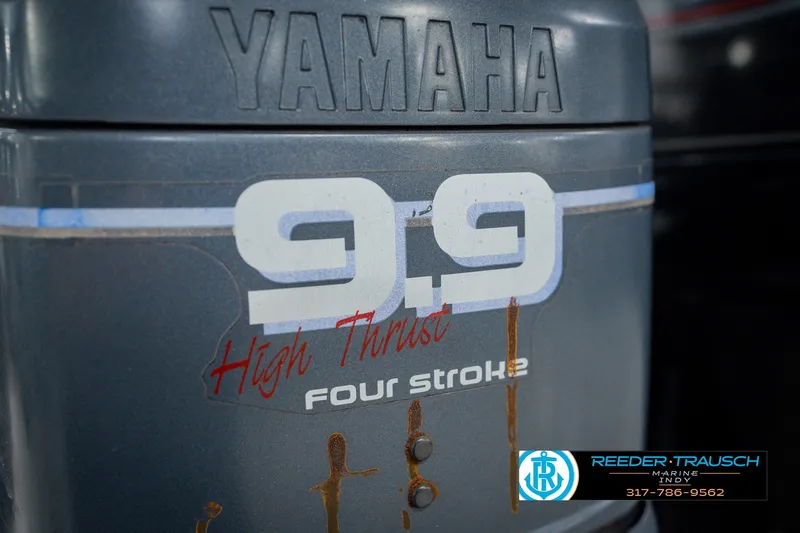 Slide: The Image of Yamaha 9.9 High Thrust outboard motor on 1999 Lund Mr. Pike 17 boat. - 52