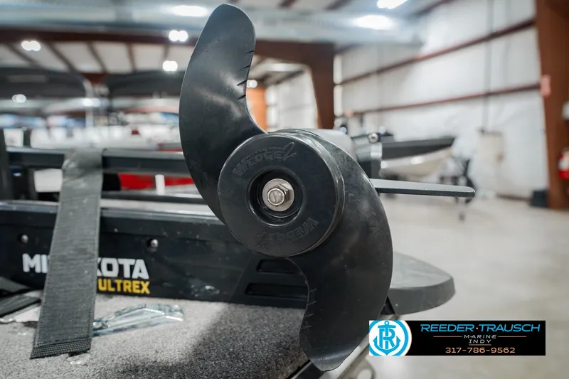 Slide: The Image of Minn Kota Ultrex motor propeller on a 1999 Lund Mr. Pike 17 boat. - 57