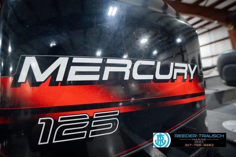Slide: The Image of Mercury 125 outboard motor on a 1999 Lund Mr. Pike 17 boat. - 47
