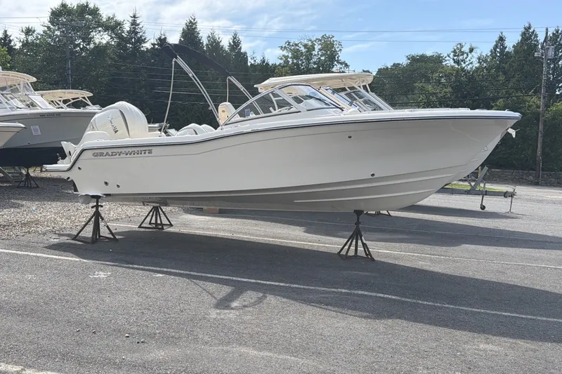 Slide: The Image of A 2027 Grady-White Freedom 215 boat is on stands in an outdoor area. - 3