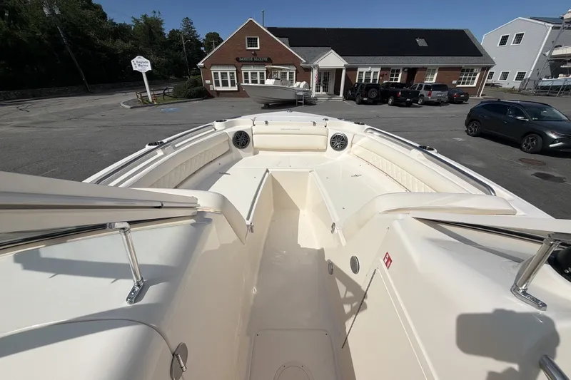 Slide: The Image of The image shows the deck of a Grady-White Freedom 215 boat parked in a lot. - 9