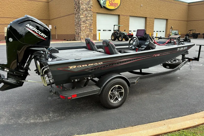 Slide: The Image of 2023 Ranger RT178 boat with Mercury engine parked outside a store. - 3