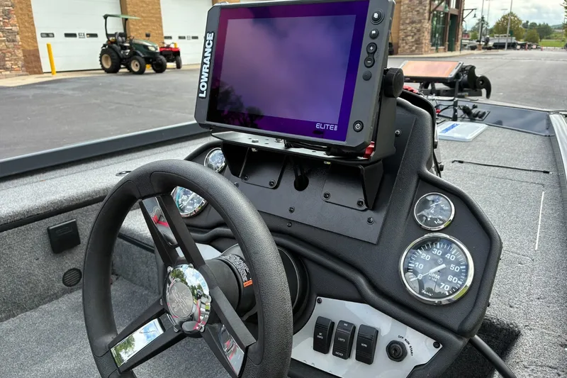 Slide: The Image of 2023 Ranger RT178 boat dashboard with Lowrance Elite display and steering wheel. - 6
