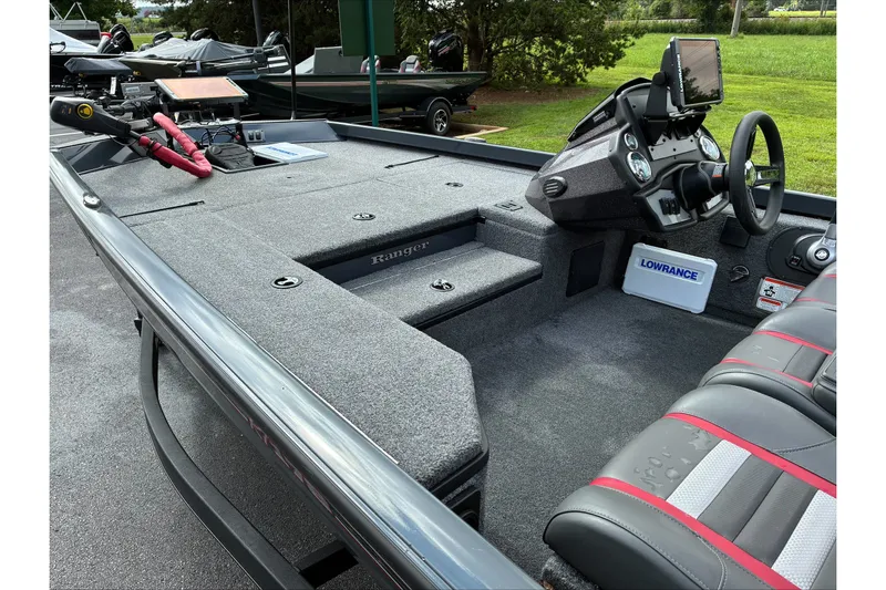Slide: The Image of 2023 Ranger RT178 boat interior with steering console and fishing equipment. - 10