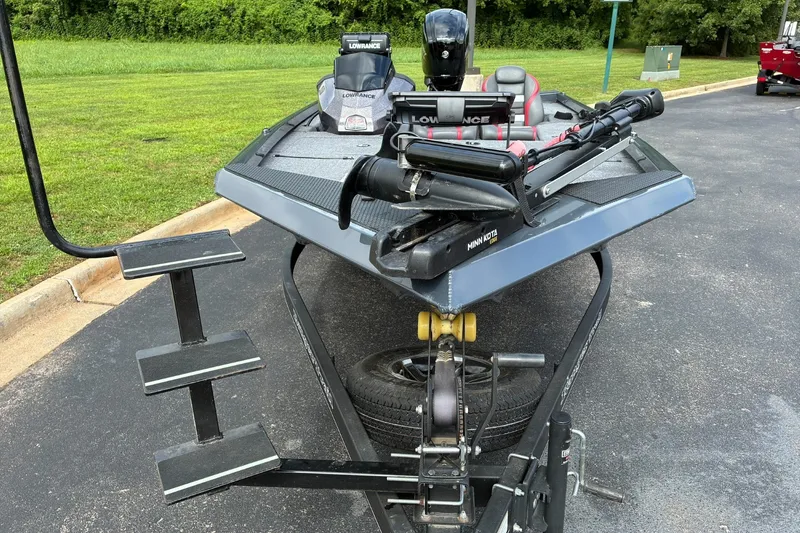 Slide: The Image of 2023 Ranger RT178 boat with Minn Kota trolling motor on trailer, parked on asphalt. - 5