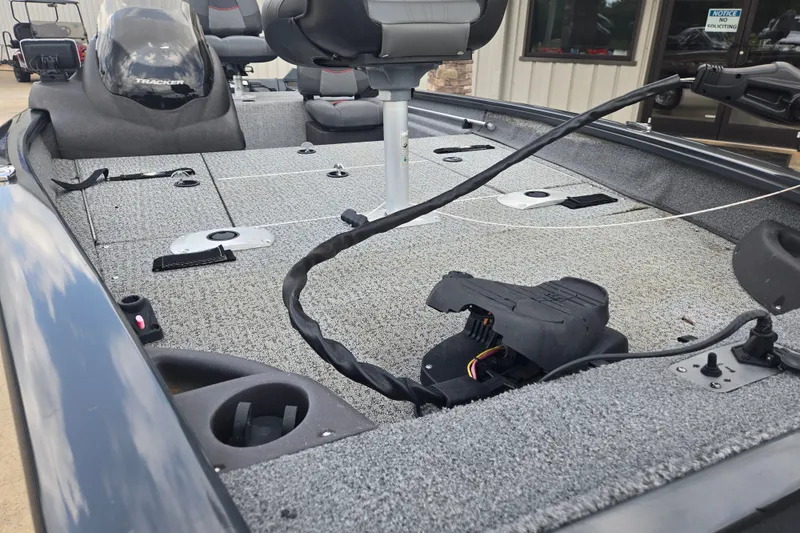 Slide: The Image of 2022 Tracker Pro Team 175 TF boat interior with seating and fishing deck. - 15