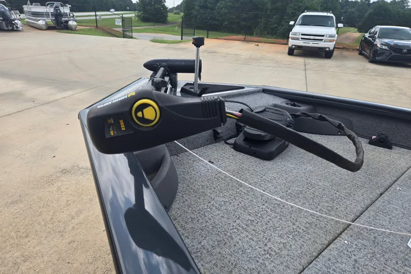Slide: The Image of 2022 Tracker Pro Team 175 TF boat with Minn Kota trolling motor on deck. - 13