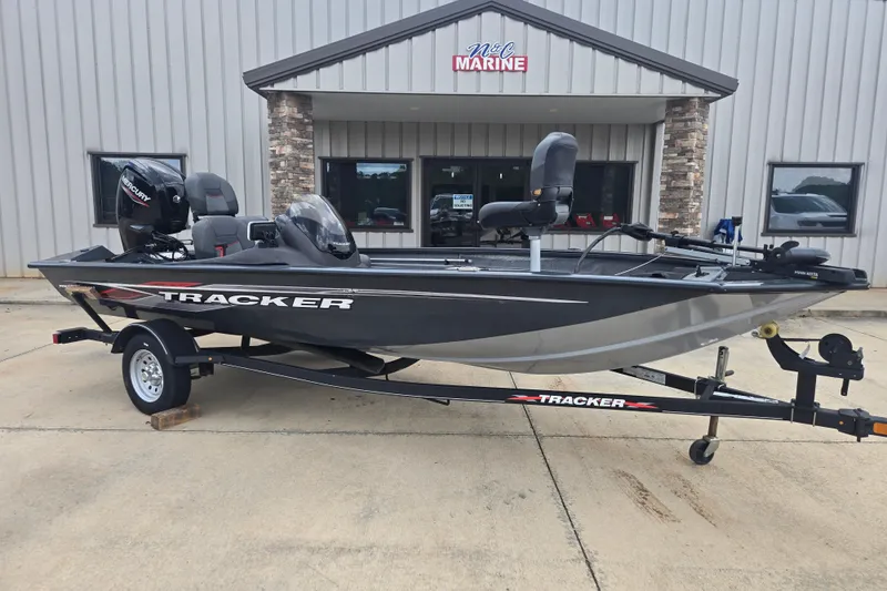 The Image of 2022 Tracker Pro Team 175 TF fishing boat on trailer outside dealership. - 0