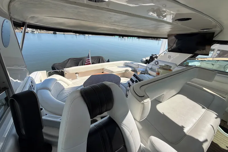Slide: The Image of Luxurious interior of a 1994 Sea Ray 500 Sundancer yacht with comfortable seating and scenic water view. - 24