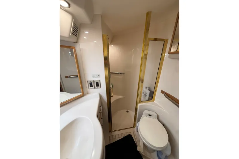 Slide: The Image of Luxurious bathroom in 1994 Sea Ray 500 Sundancer yacht with shower and toilet. - 47