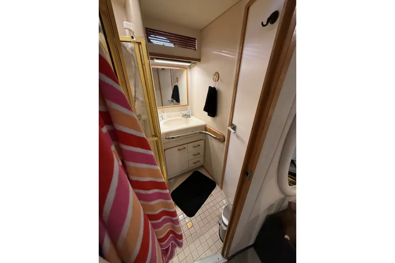 Slide: The Image of Bathroom interior of 1994 Sea Ray 500 Sundancer yacht with sink and shower. - 36